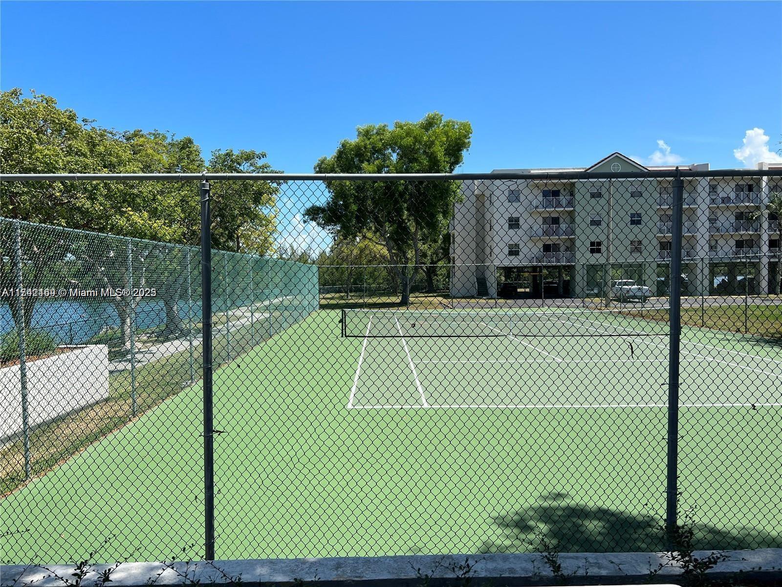 8260 Southwest 210th Street, Unit 220 Cutler Bay, FL 33189 - Photo 18 of 20 a view of a tennis court