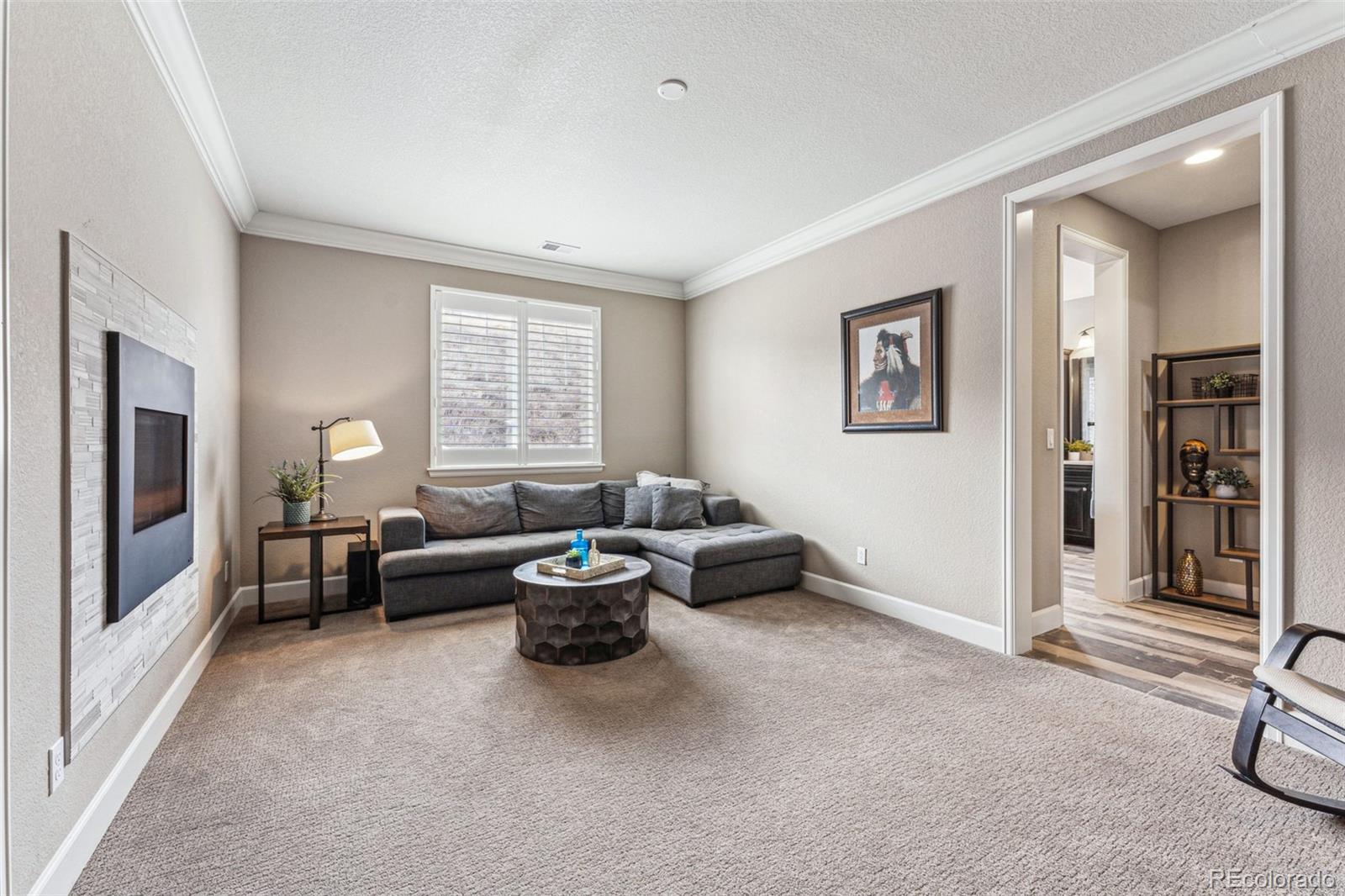 4937 Hogback Ridge Road Morrison, CO 80465 - Photo 19 of 43 a living room with furniture and a window