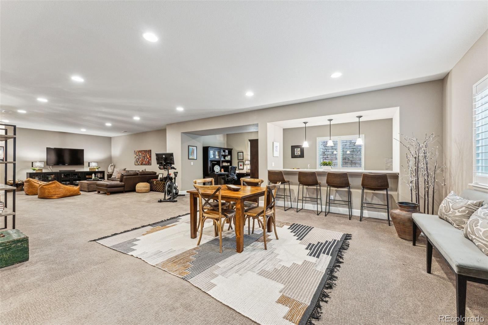 4937 Hogback Ridge Road Morrison, CO 80465 - Photo 30 of 43 a living room with furniture a table and a large window