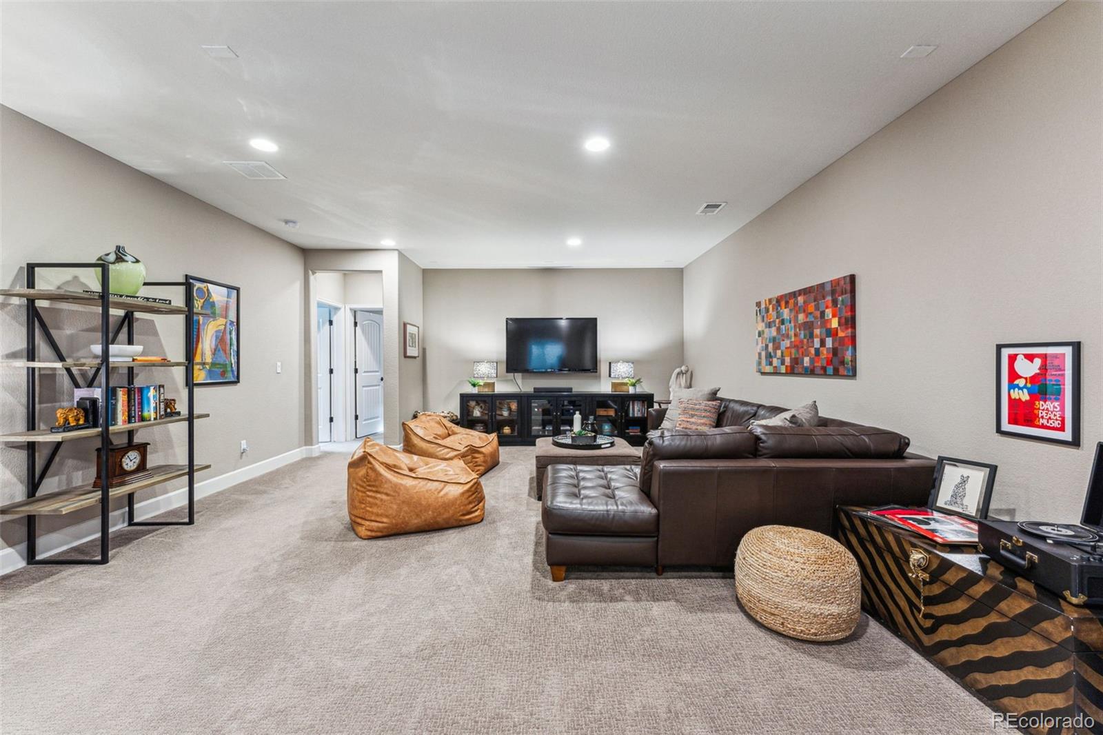 4937 Hogback Ridge Road Morrison, CO 80465 - Photo 35 of 43 a living room with furniture and a flat screen tv