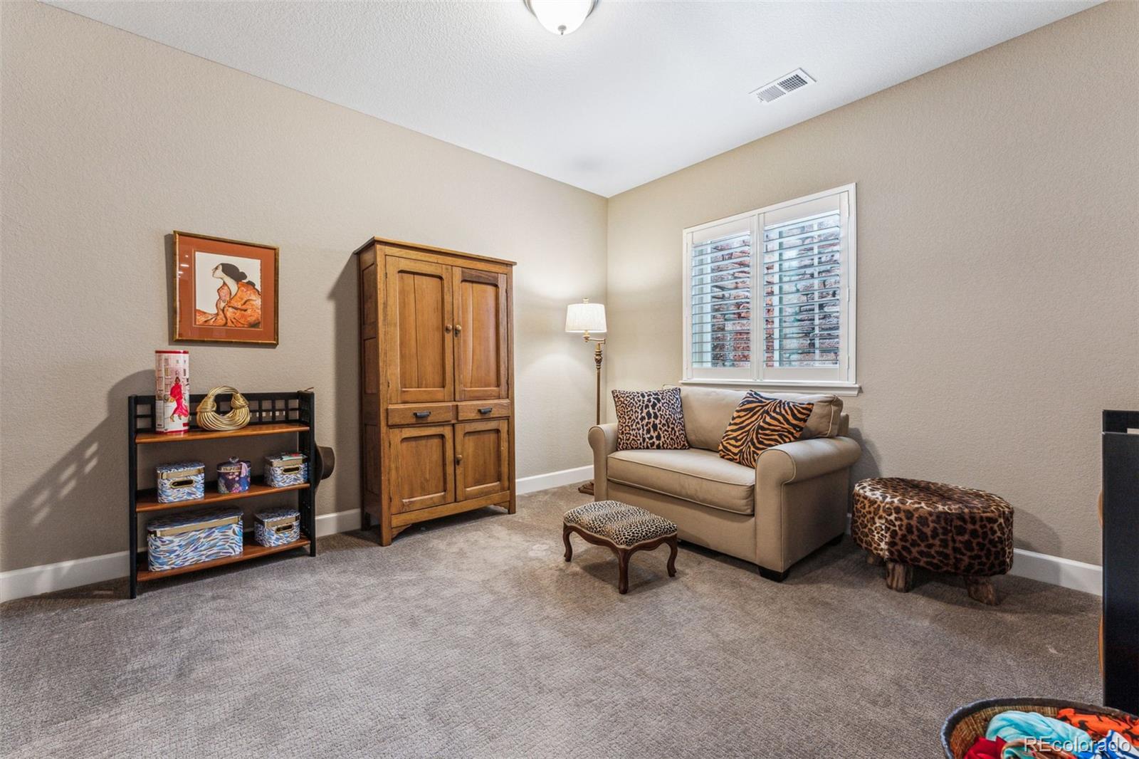 4937 Hogback Ridge Road Morrison, CO 80465 - Photo 37 of 43 a living room with furniture and a window