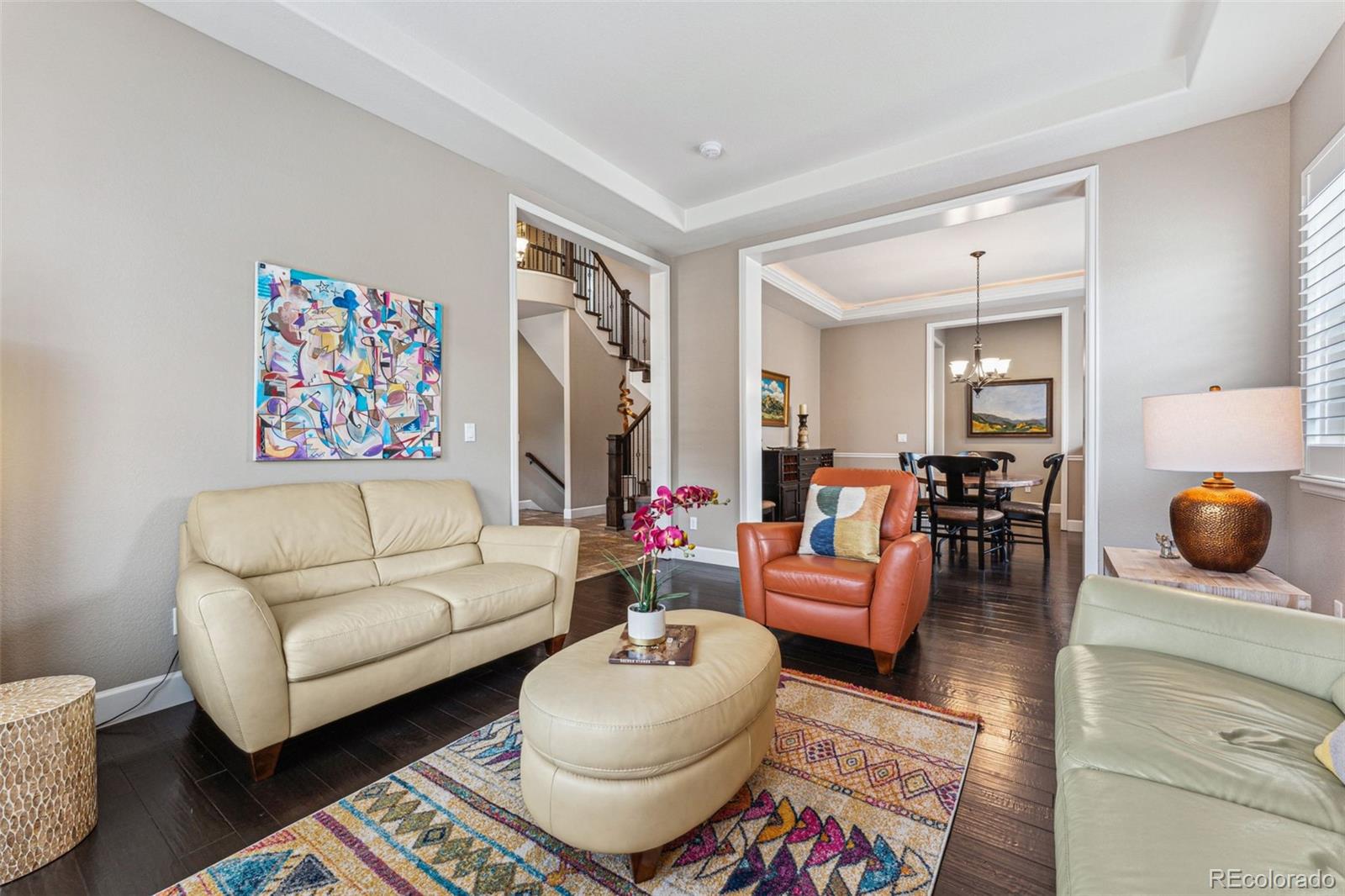 4937 Hogback Ridge Road Morrison, CO 80465 - Photo 5 of 43 a living room with furniture and a rug