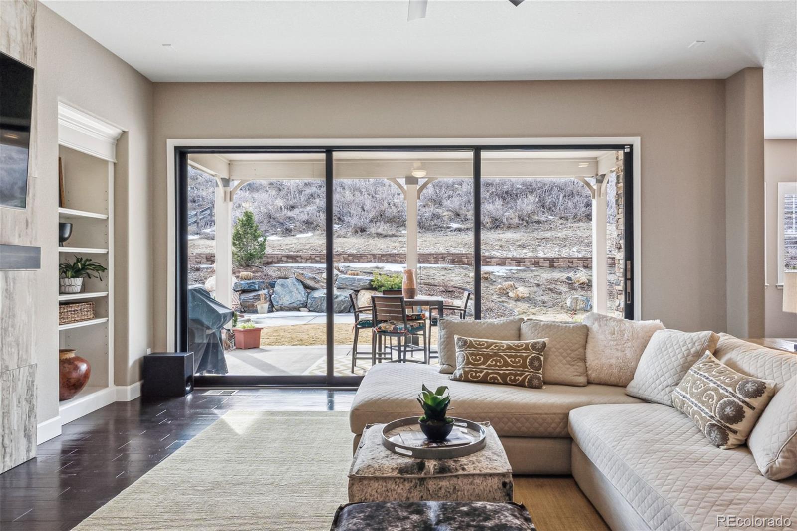 4937 Hogback Ridge Road Morrison, CO 80465 - Photo 9 of 43 a living room with furniture and a large window