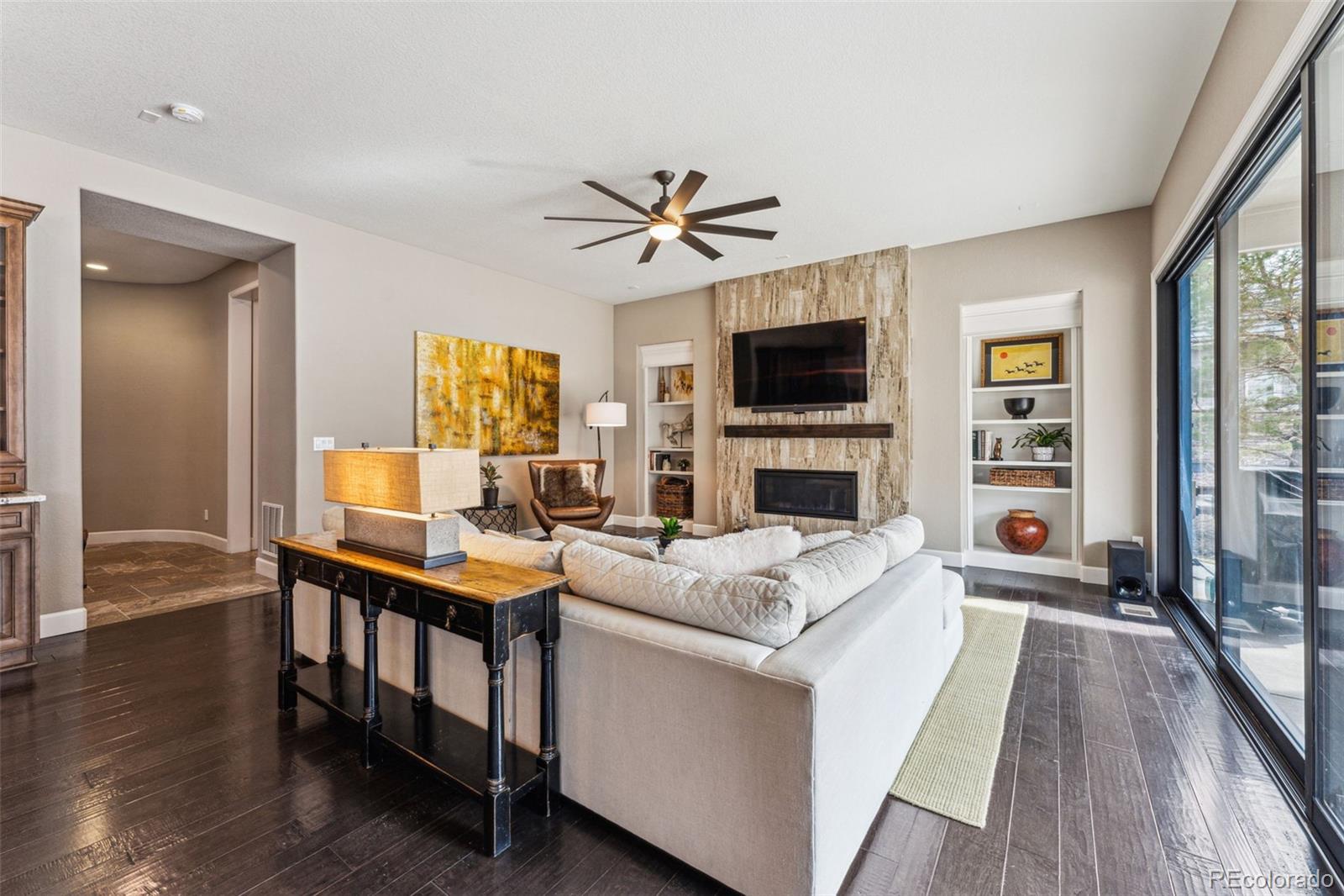 4937 Hogback Ridge Road Morrison, CO 80465 - Photo 10 of 43 a living room with fireplace furniture and a flat screen tv