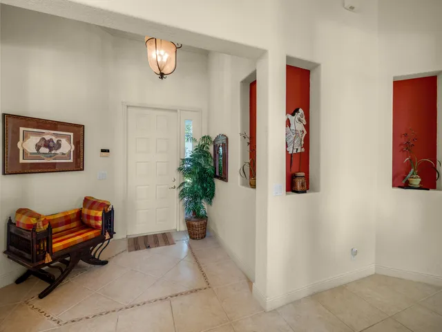 a entryway with furniture and potted plant