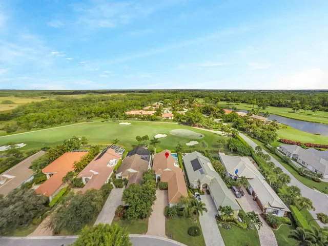 an aerial view of residential building and ocean view