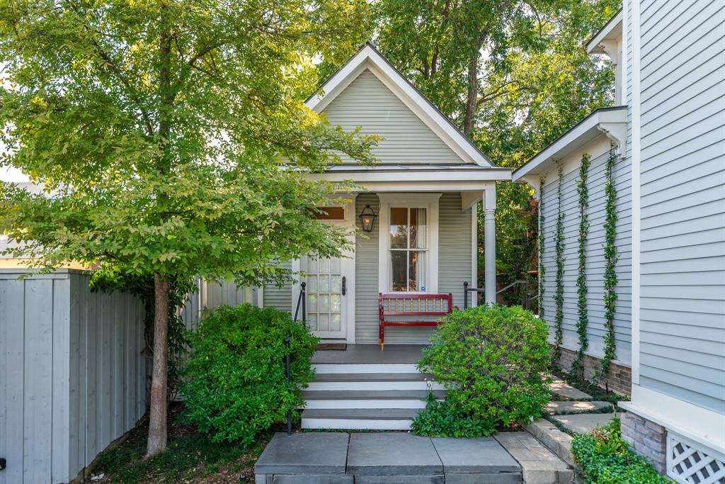 2315 Routh Street Dallas, TX 75201 - Photo 27 of 38 a front view of a house with a yard