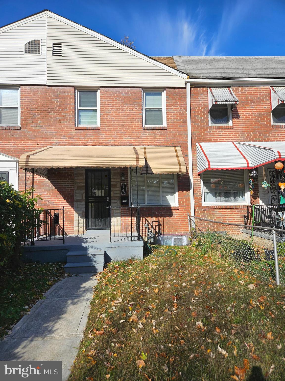 4546 Mountview Road Baltimore, MD 21229 - Photo 2 of 45 a front view of a house with a yard