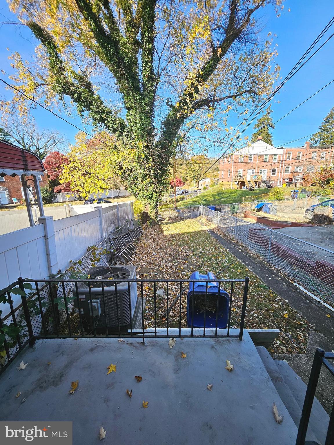 4546 Mountview Road Baltimore, MD 21229 - Photo 41 of 45 a view of a patio with table and chairs under an umbrella