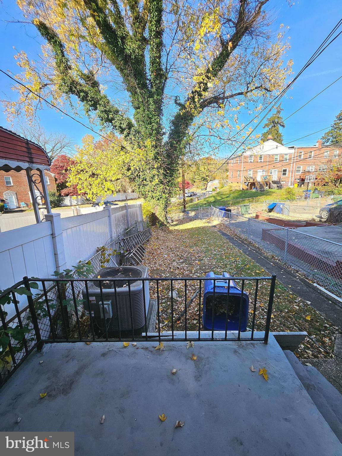 4546 Mountview Road Baltimore, MD 21229 - Photo 42 of 45 a view of a patio with table and chairs with wooden fence and plants