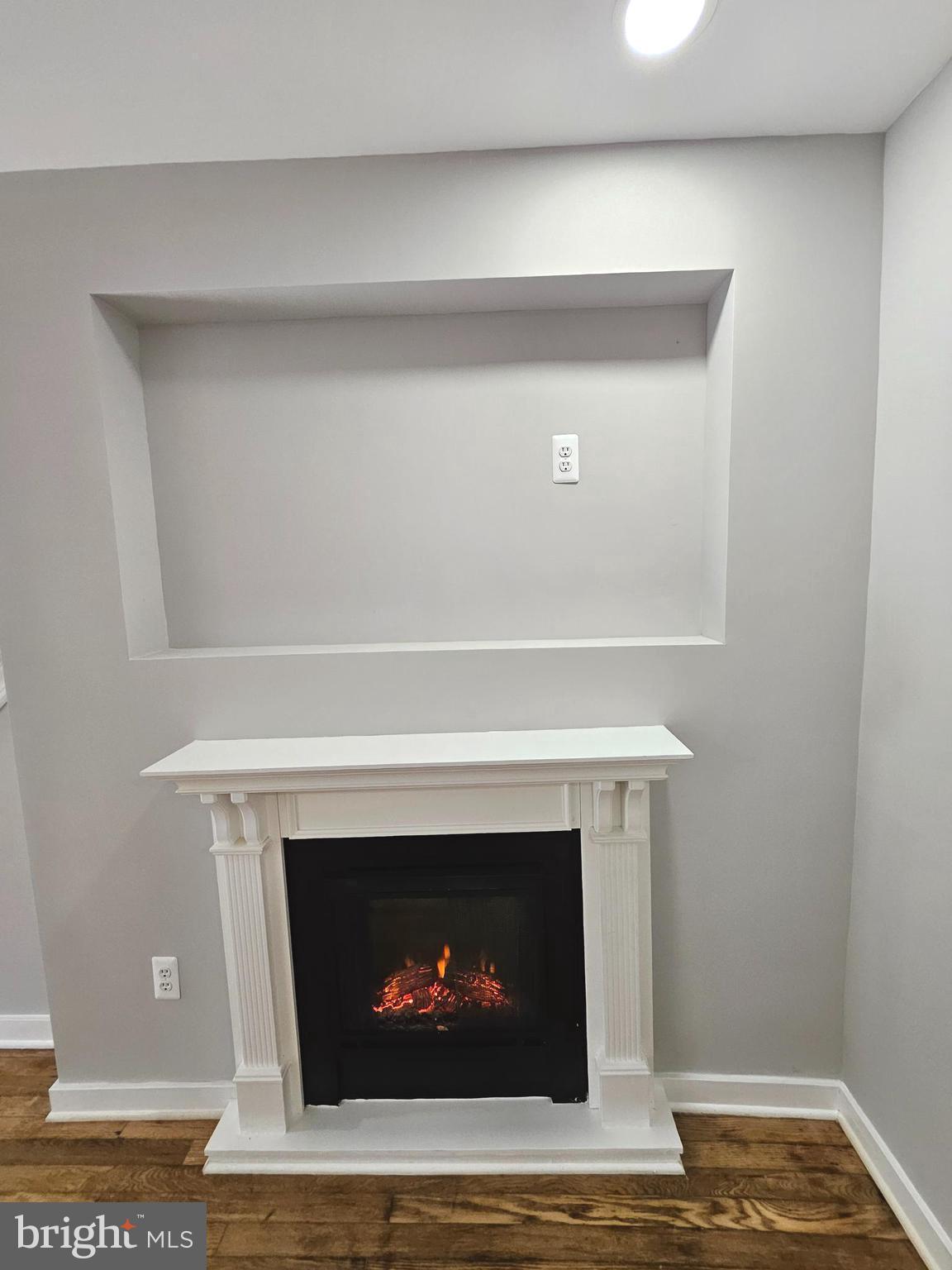 4546 Mountview Road Baltimore, MD 21229 - Photo 6 of 45 a white building with a fireplace