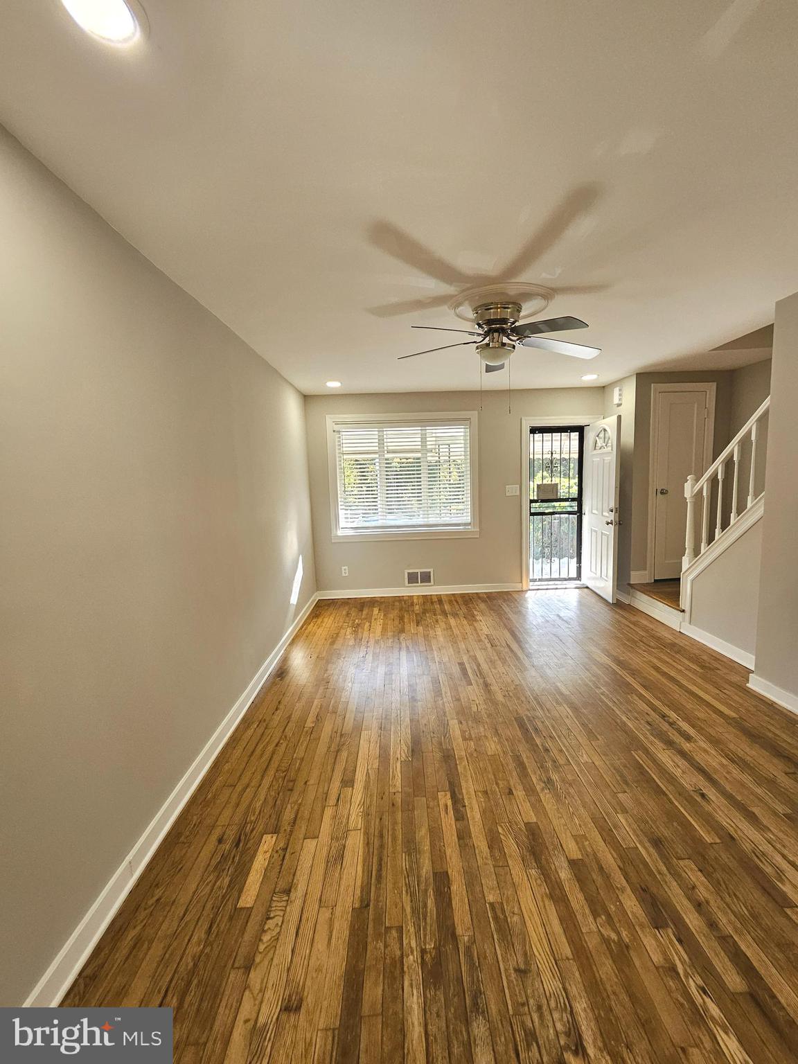 4546 Mountview Road Baltimore, MD 21229 - Photo 8 of 45 wooden floor in an empty room with a window