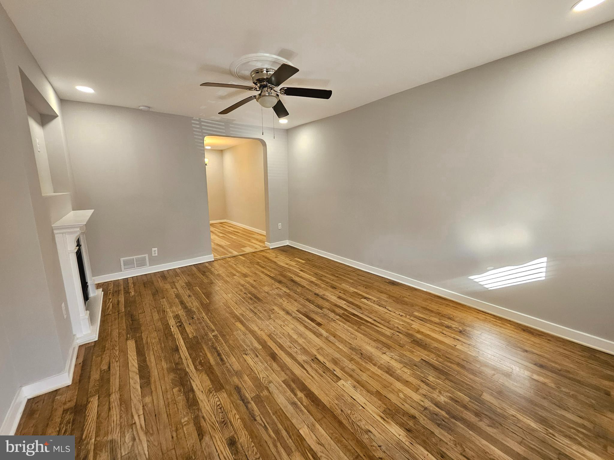 4546 Mountview Road Baltimore, MD 21229 - Photo 9 of 45 a view of an empty room and wooden floor