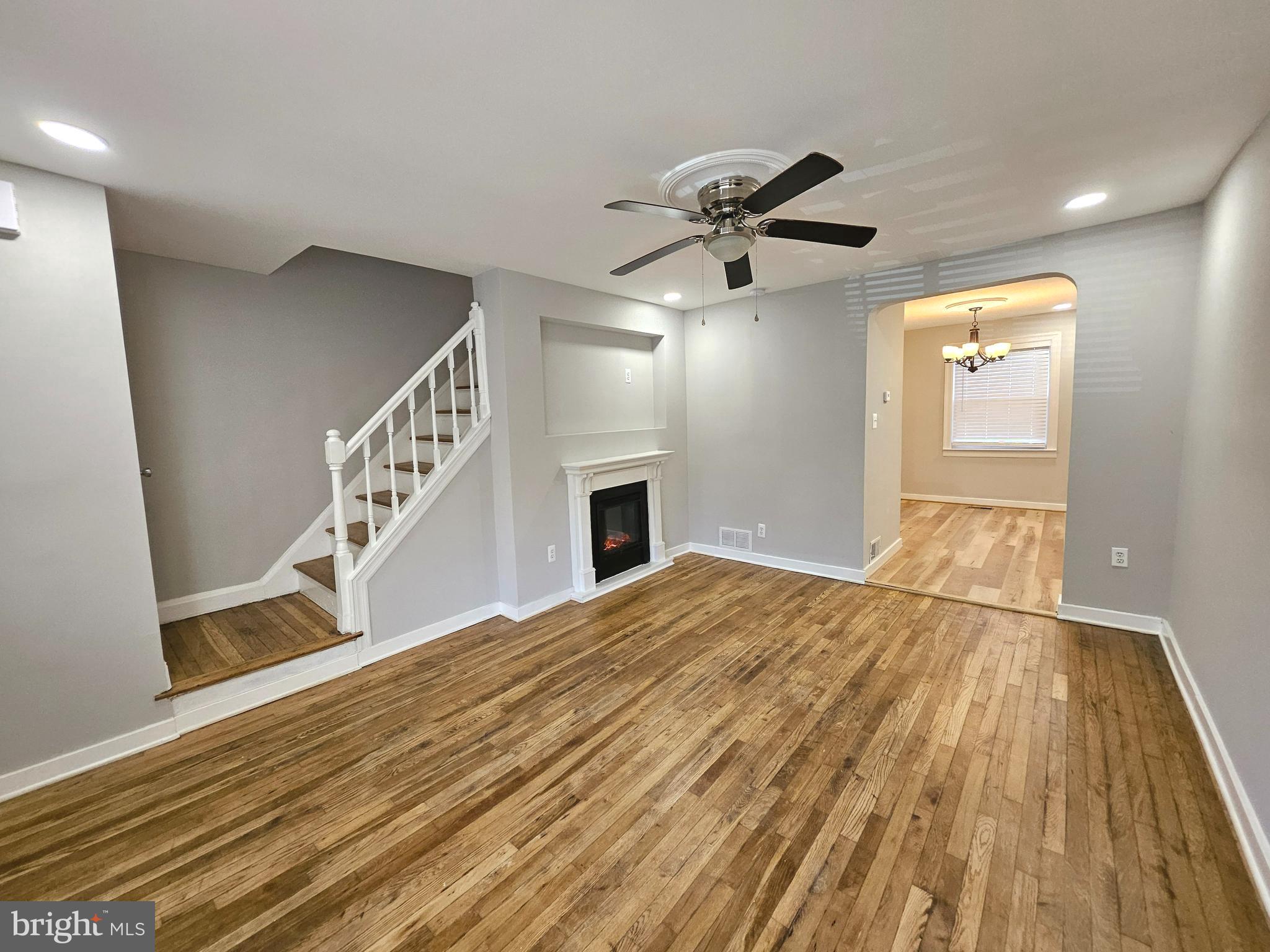 4546 Mountview Road Baltimore, MD 21229 - Photo 10 of 45 a view of empty room with wooden floor and fan