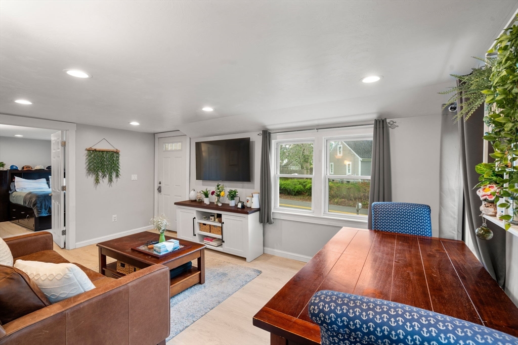 7 Indian Neck Road Wareham, MA 02571 - Photo 23 of 34 a living room with furniture and a flat screen tv