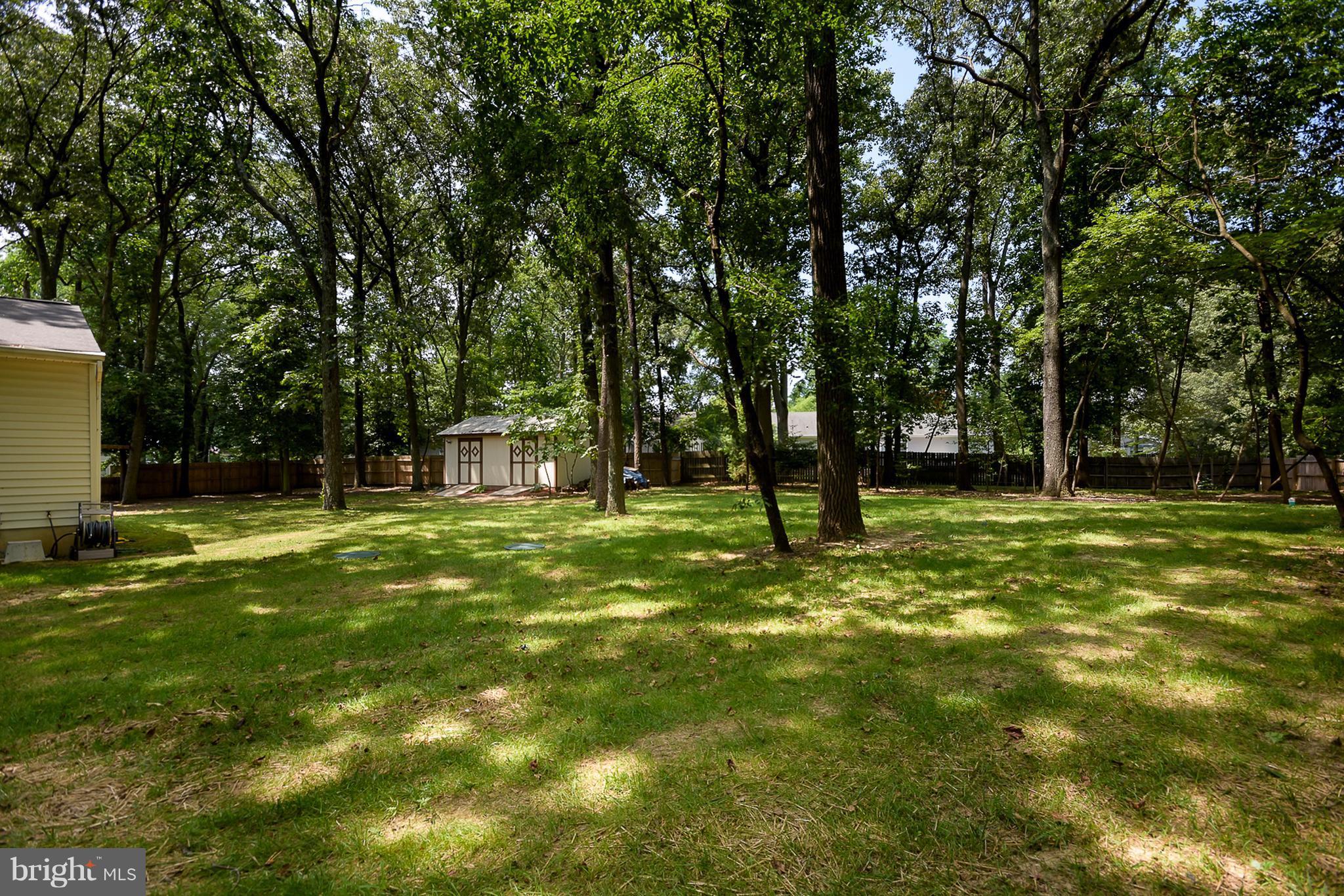214 Longmoor Road Pasadena, MD 21122 - Photo 13 of 23 Lots of space on either side of the house.