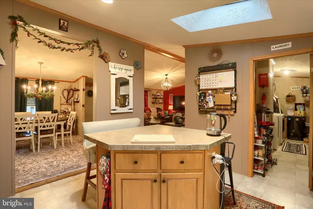 a view of a dining table chairs and entryway