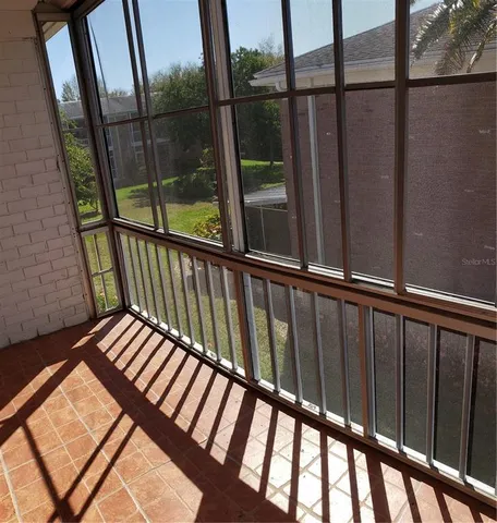 a view of balcony with wooden floor