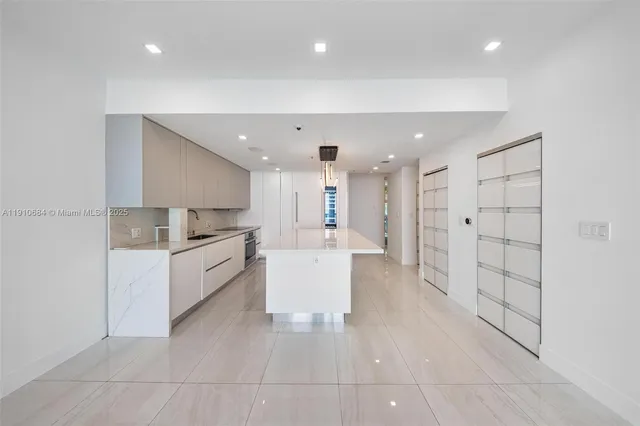 a view of a hallway with washer and dryer