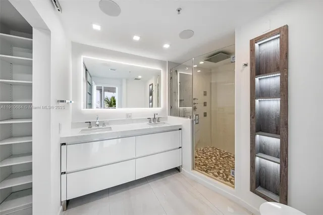 a bathroom with a double vanity sink mirror and double