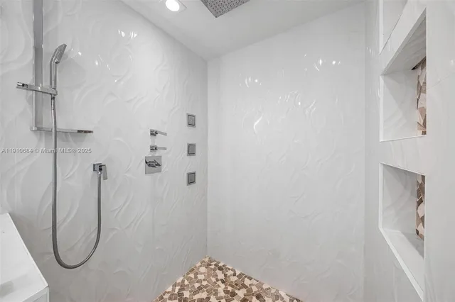 a view of an empty room with a flat screen tv