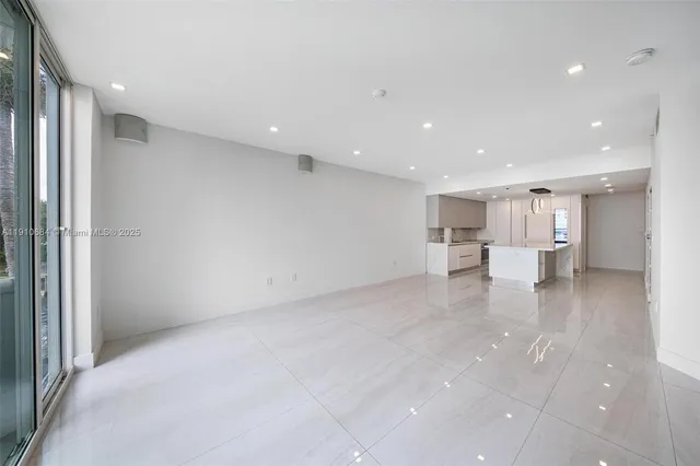 a view of an empty room with a fireplace
