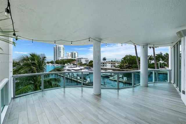 a view of a balcony with yard