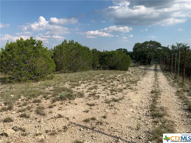 a view of a lake with a yard