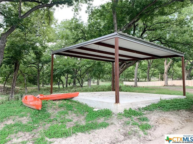 a view of a lake view with a large trees