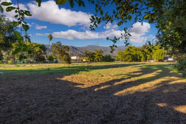 a view of a golf course with a lake