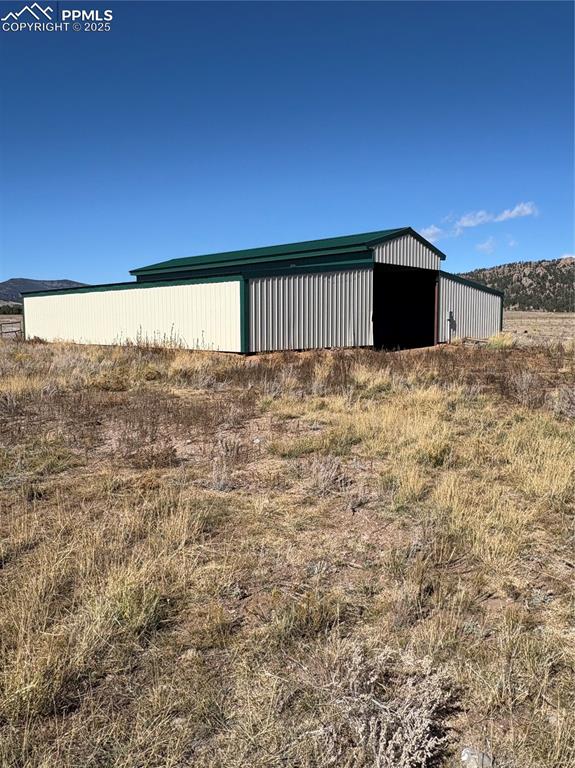 1925 Doe Valley Road Guffey, CO 80820 - Photo 22 of 30 a view of a big room with wooden floor