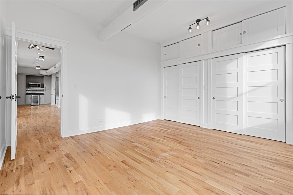 2346 West Fullerton Avenue, Unit 3 Chicago, IL 60647 - Photo 14 of 15 a view of empty room with wooden floor