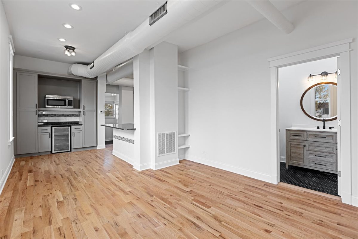 2346 West Fullerton Avenue, Unit 3 Chicago, IL 60647 - Photo 6 of 15 a view of a kitchen with a sink and a refrigerator