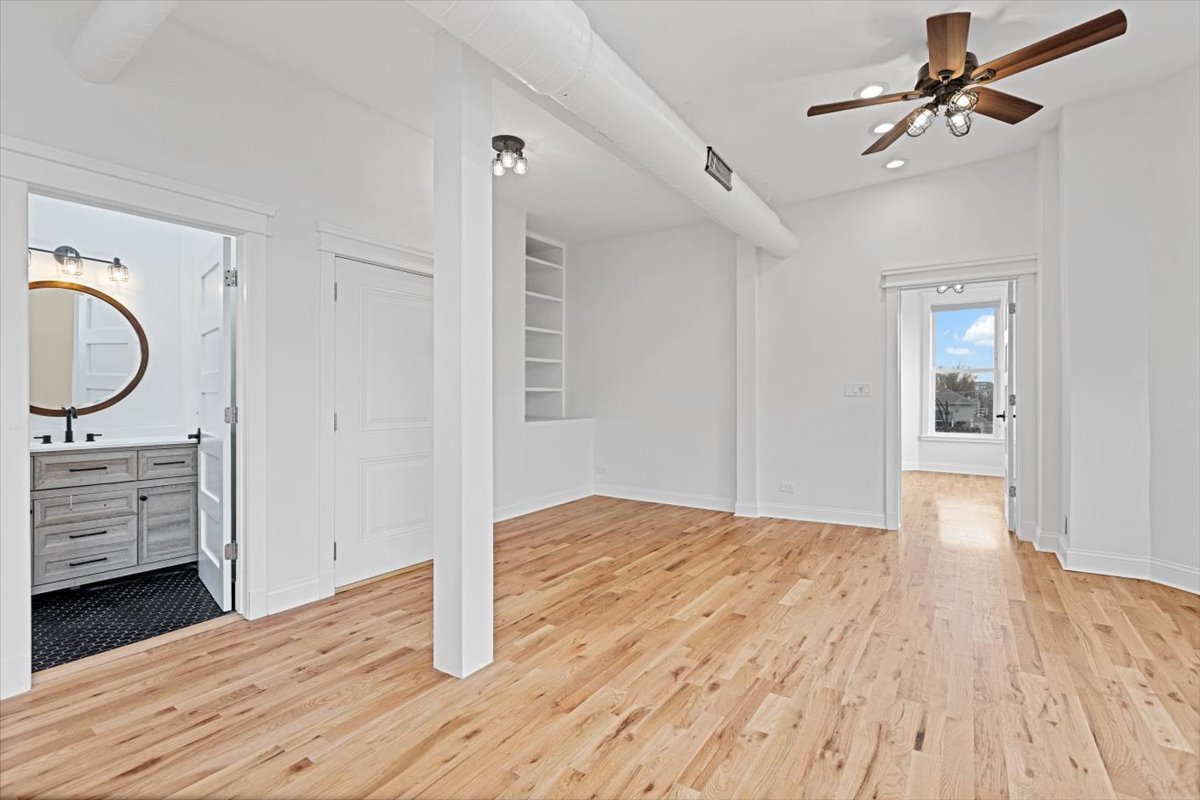 2346 West Fullerton Avenue, Unit 3 Chicago, IL 60647 - Photo 9 of 15 a view of empty room with wooden floor