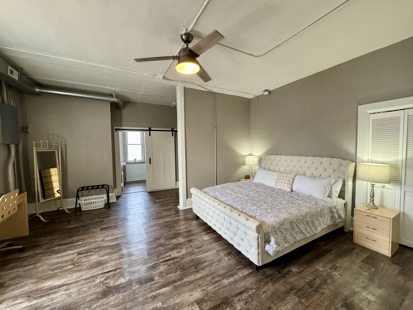 902 North Main Street Princeton, IL 61356 - Photo 18 of 33 a bedroom with a bed and a chandelier