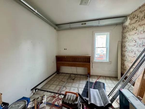 a bathroom with a shower and a sink