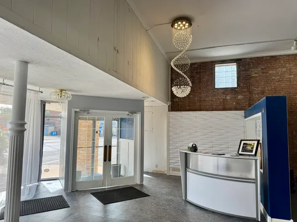 a view of a refrigerator in kitchen and wooden floor