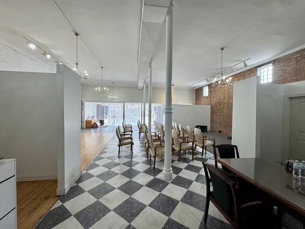 a lobby with a couch and a rug