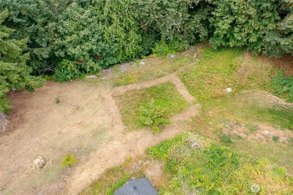 a view of a lake with a yard