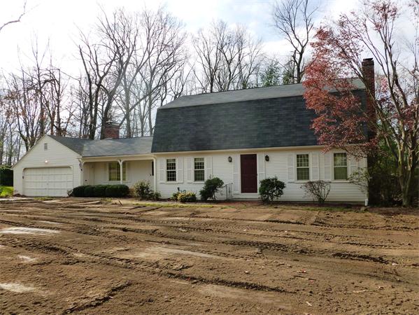 20 West Colonial Road Wilbraham, MA 01095 - Photo 1 of 18 a view of a house with a yard covered in snow