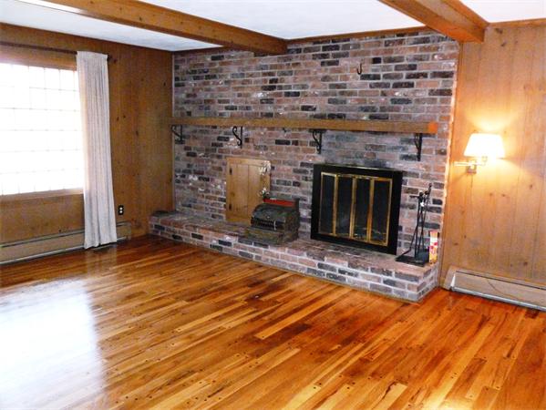 20 West Colonial Road Wilbraham, MA 01095 - Photo 4 of 18 a living room with a fireplace