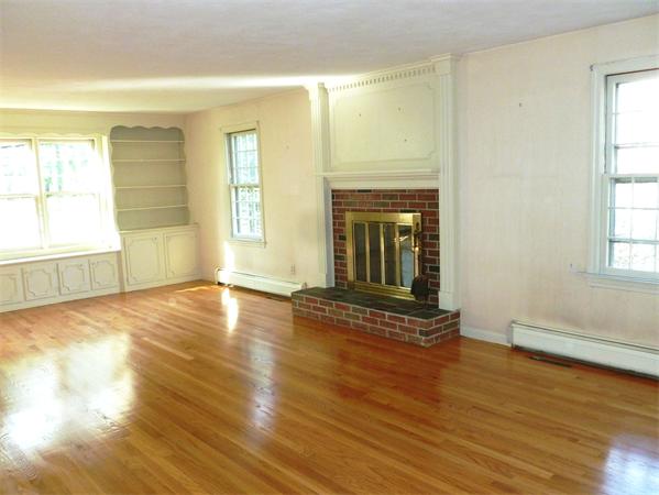 20 West Colonial Road Wilbraham, MA 01095 - Photo 10 of 18 an empty room with wooden floor and windows