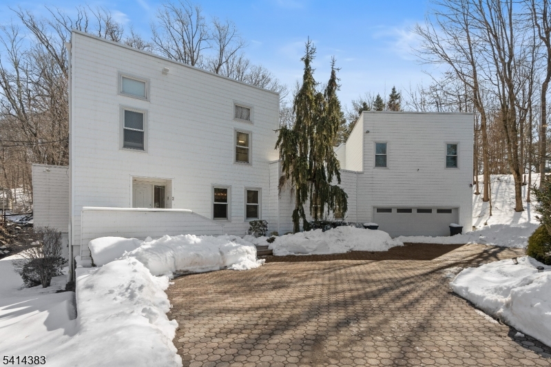 a view of a house with snow