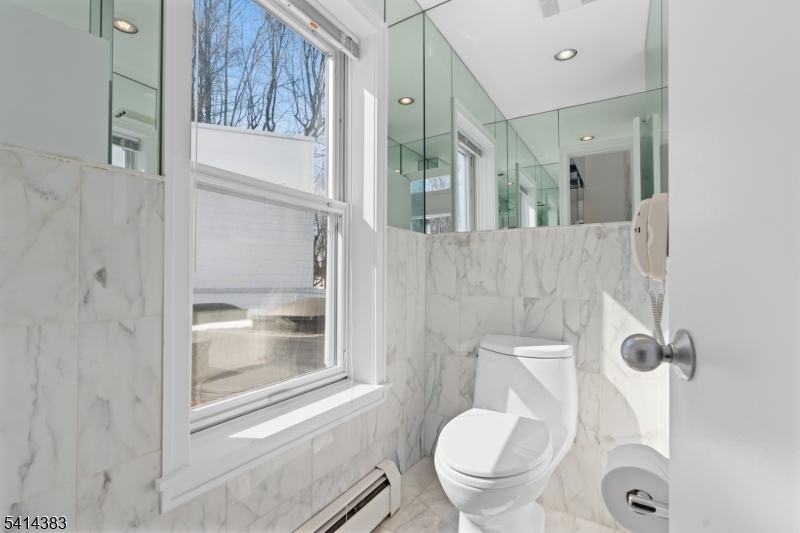 2 Old Mill Road North Caldwell, NJ 07006 - Photo 15 of 25 a bathroom with a toilet and a shower