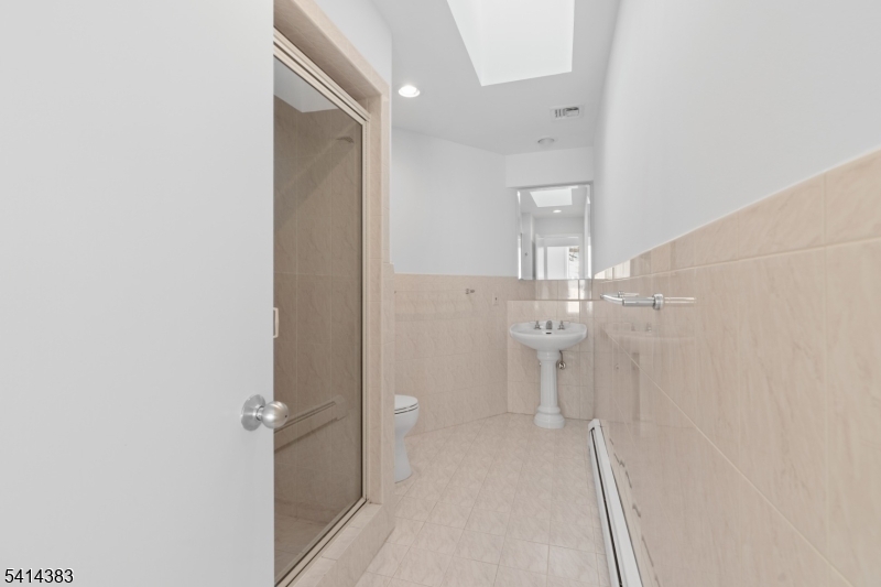 2 Old Mill Road North Caldwell, NJ 07006 - Photo 19 of 25 a view of a bathroom with a shower and a sink