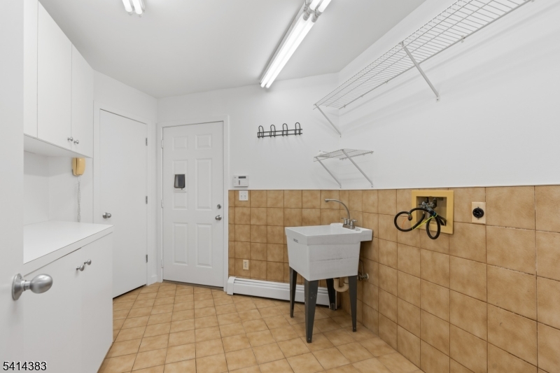 2 Old Mill Road North Caldwell, NJ 07006 - Photo 20 of 25 a bathroom with a sink a toilet and bathtub