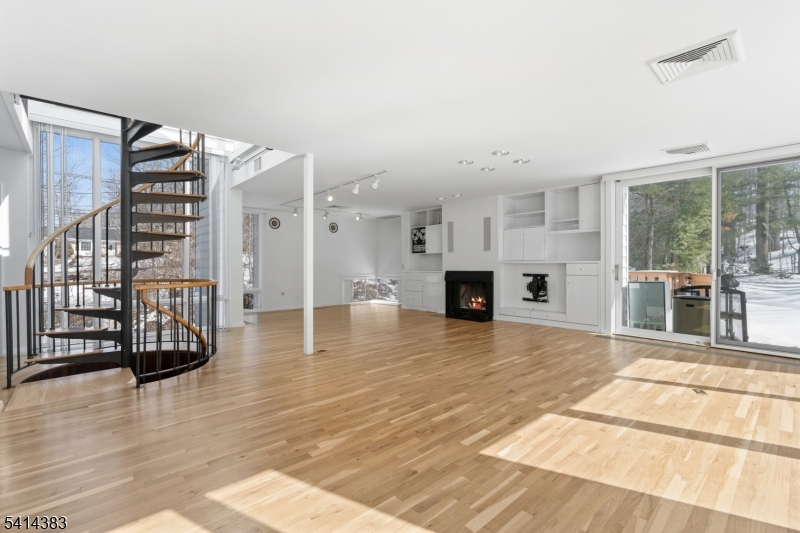 2 Old Mill Road North Caldwell, NJ 07006 - Photo 2 of 25 a view of a living room and kitchen floor