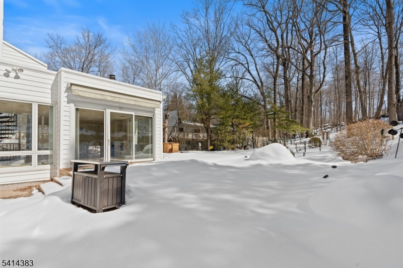 2 Old Mill Road North Caldwell, NJ 07006 - Photo 24 of 25 a view of a house with a snow in the yard