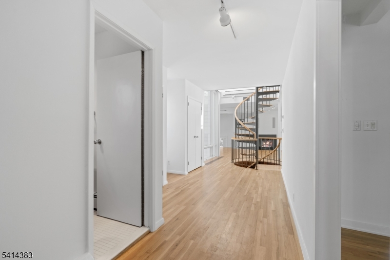 2 Old Mill Road North Caldwell, NJ 07006 - Photo 5 of 25 a view of a room with wooden floor cabinet and windows