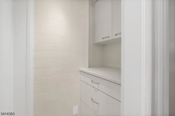 a bathroom with a close shower view